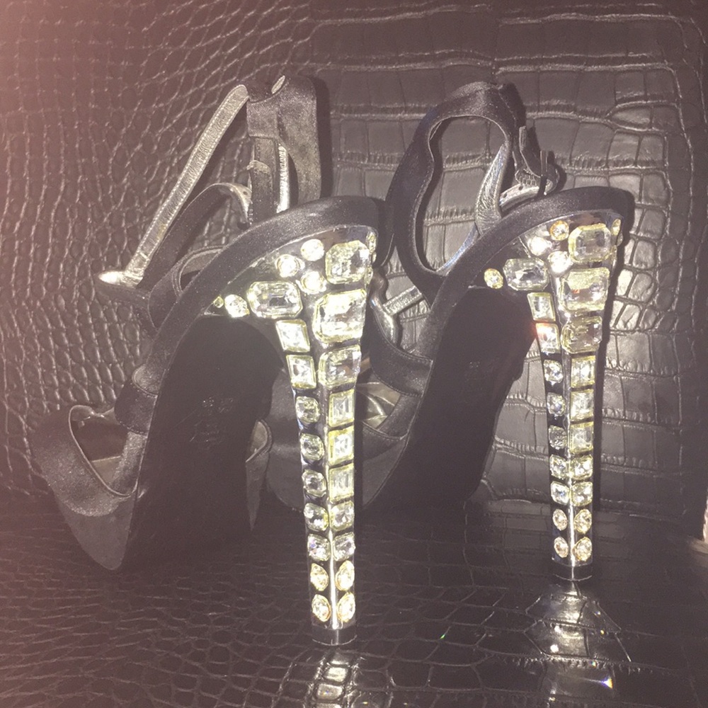 Black and silver shoes with diamonds on the heels